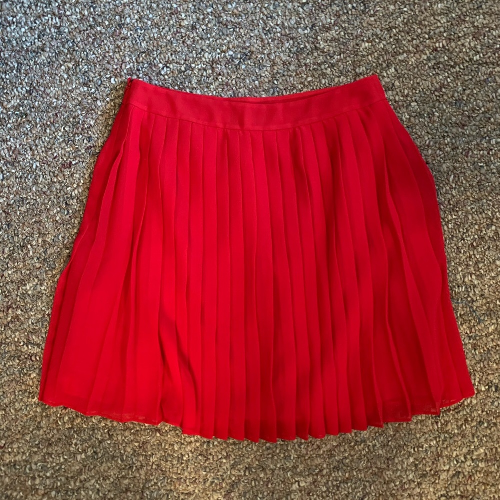 Red pleated skirt